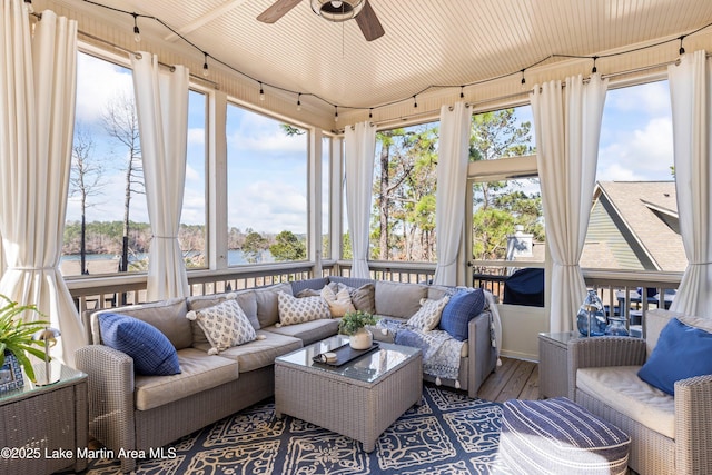 sunroom / solarium with a healthy amount of sunlight and ceiling fan