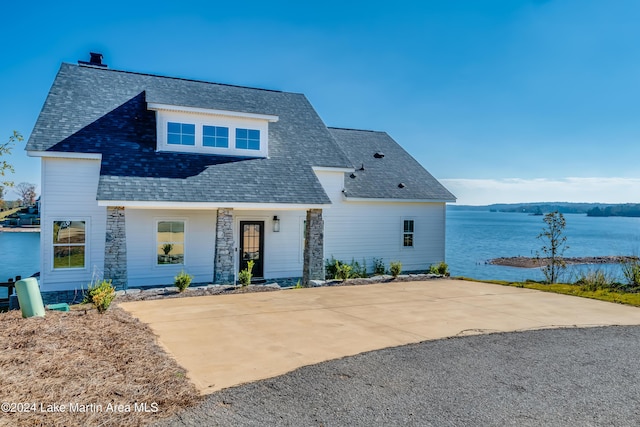 view of front of property with a water view