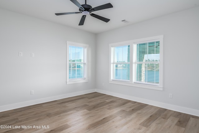 unfurnished room featuring ceiling fan and light hardwood / wood-style floors