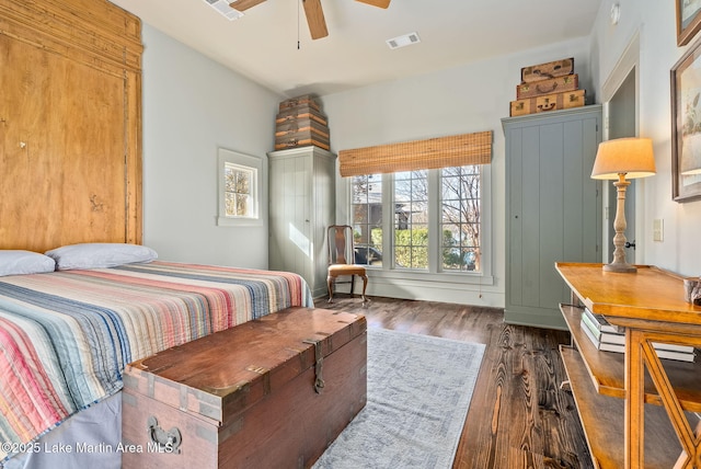 bedroom featuring ceiling fan and dark hardwood / wood-style flooring