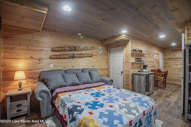 bedroom featuring dark hardwood / wood-style floors, wood walls, and wooden ceiling