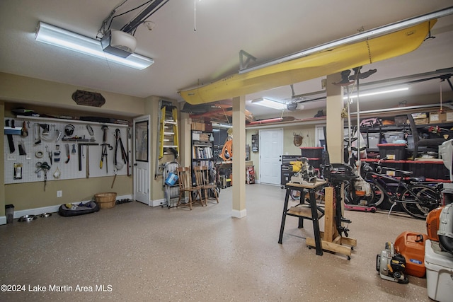 garage featuring a workshop area and a garage door opener