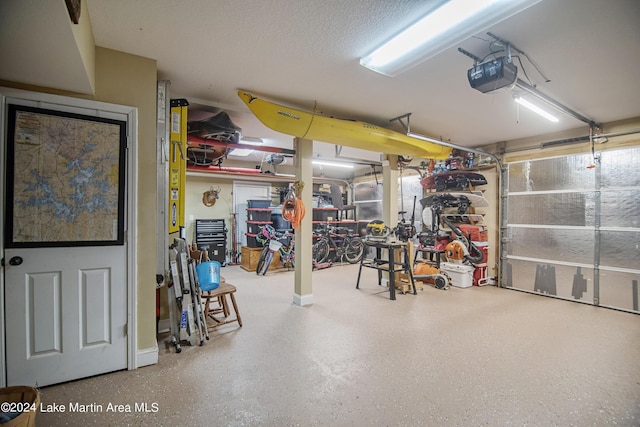 garage featuring a workshop area and a garage door opener