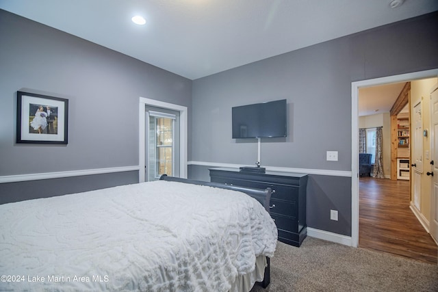 bedroom with hardwood / wood-style flooring