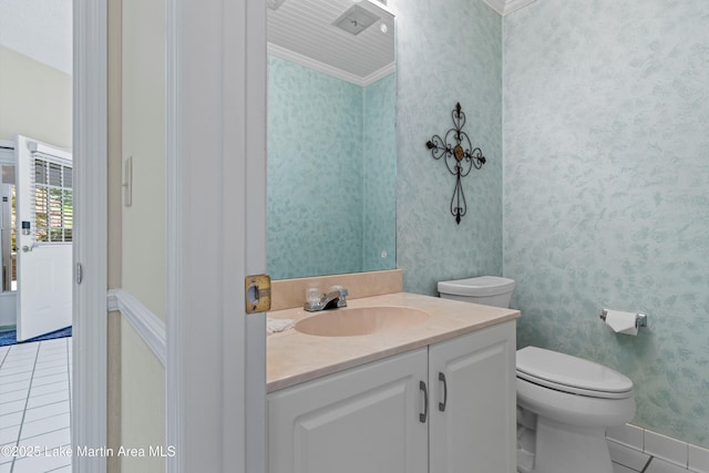 970 Raintree Dr, Alexander City, AL 35010 - half bathroom featuring tile patterned flooring, vanity, wallpapered walls, and crown molding
