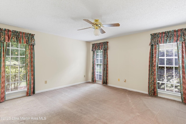 970 Raintree Dr, Alexander City, AL 35010 - carpeted empty room featuring ceiling fan, plenty of natural light, and a textured ceiling