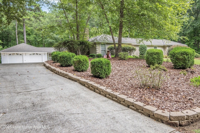970 Raintree Dr, Alexander City, AL 35010 - view of front of house with concrete driveway and an outdoor structure