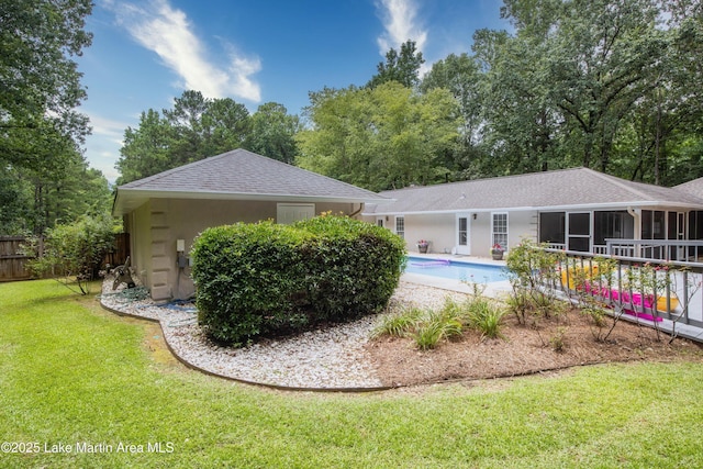 970 Raintree Dr, Alexander City, AL 35010 - back of property with a shingled roof, a sunroom, and stucco siding