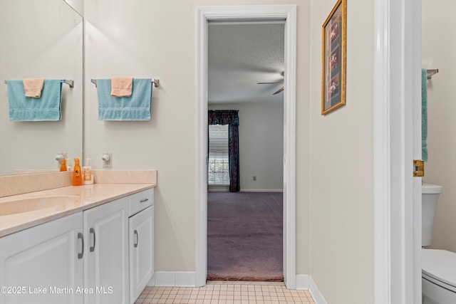 970 Raintree Dr, Alexander City, AL 35010 - bathroom with vanity, tile patterned floors, a textured ceiling, and a ceiling fan