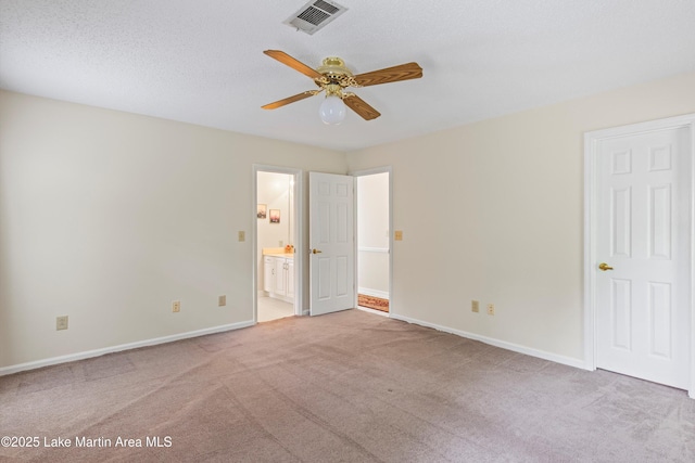 970 Raintree Dr, Alexander City, AL 35010 - unfurnished bedroom featuring light colored carpet, ensuite bath, and ceiling fan
