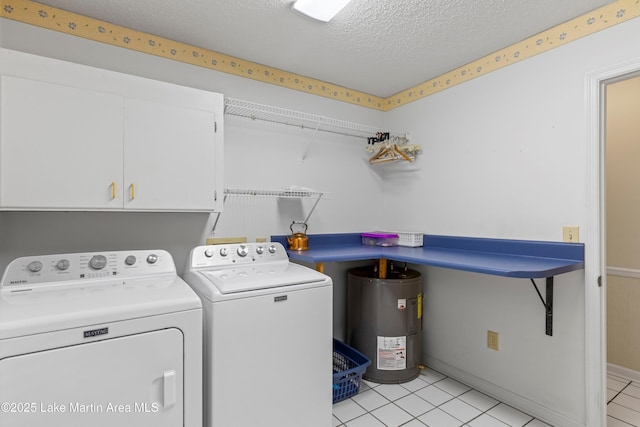 970 Raintree Dr, Alexander City, AL 35010 - laundry area with water heater, washing machine and clothes dryer, cabinet space, a textured ceiling, and light tile patterned floors