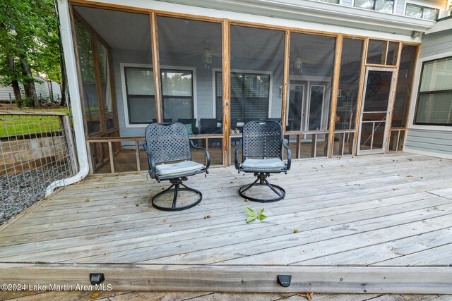 deck with a sunroom