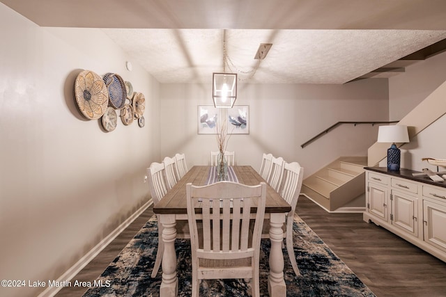 dining space with a chandelier and dark wood-type flooring