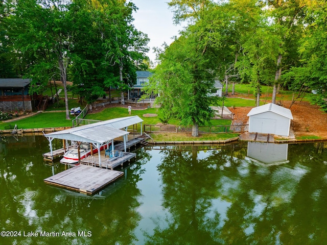 dock area featuring a yard and a water view