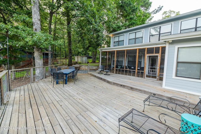 wooden terrace with a sunroom