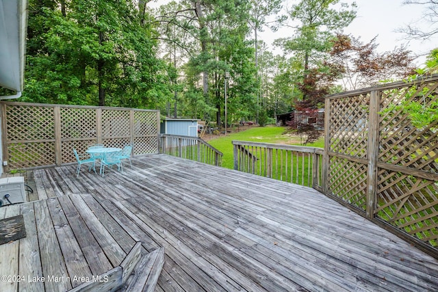 wooden deck with a yard