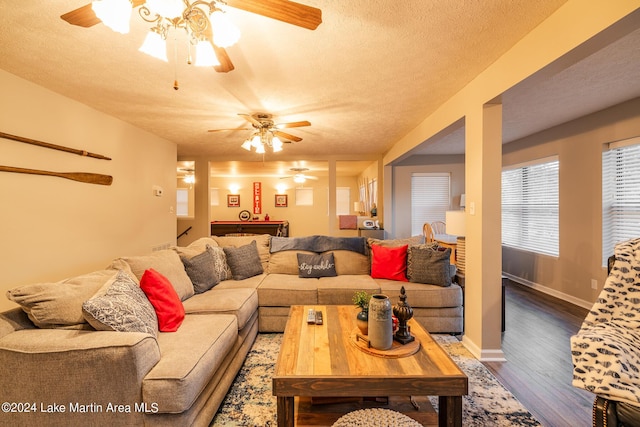 living room featuring hardwood / wood-style flooring, a textured ceiling, and pool table