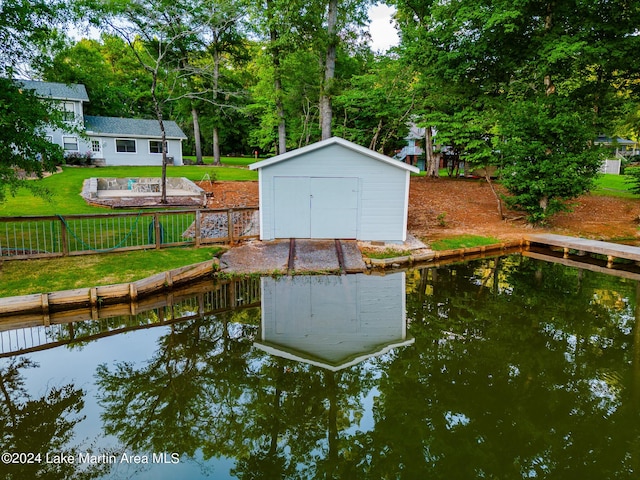 dock area featuring a yard and a water view