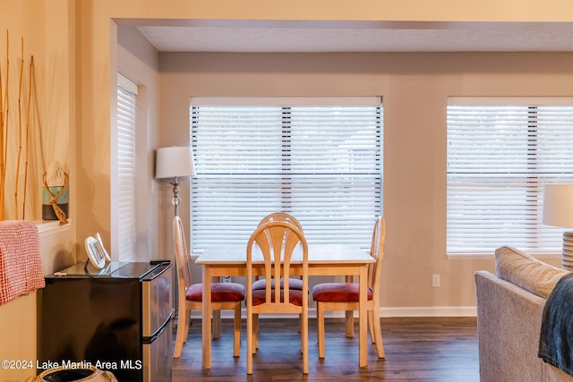 dining room with dark wood-type flooring