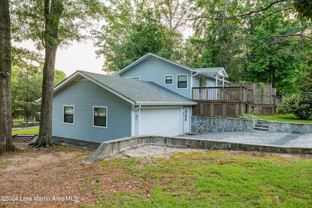 rear view of house with a wooden deck