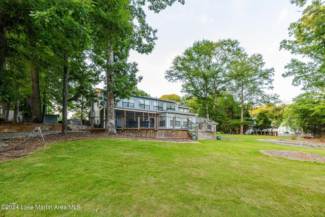 rear view of property with a yard