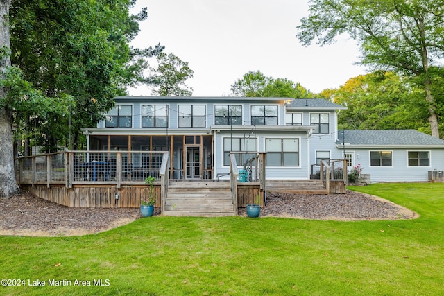 back of house featuring a yard and cooling unit