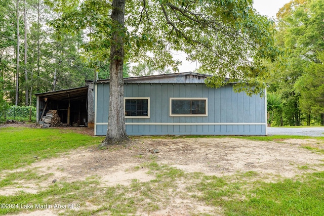 view of side of property with an outbuilding