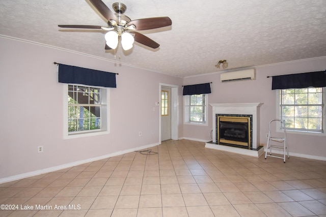 unfurnished living room featuring light tile patterned floors, a textured ceiling, a wall mounted AC, and ornamental molding