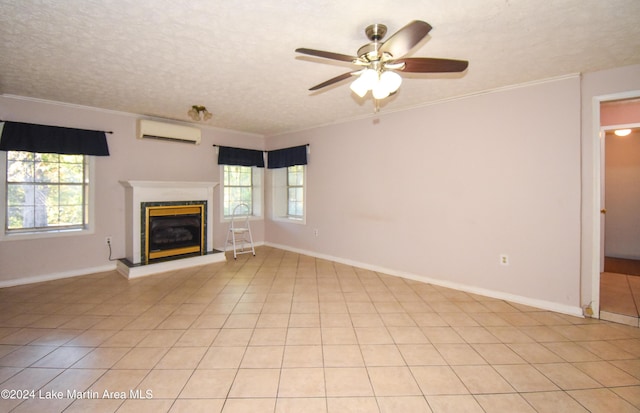 unfurnished living room with a wall mounted air conditioner, light tile patterned floors, a textured ceiling, and ornamental molding