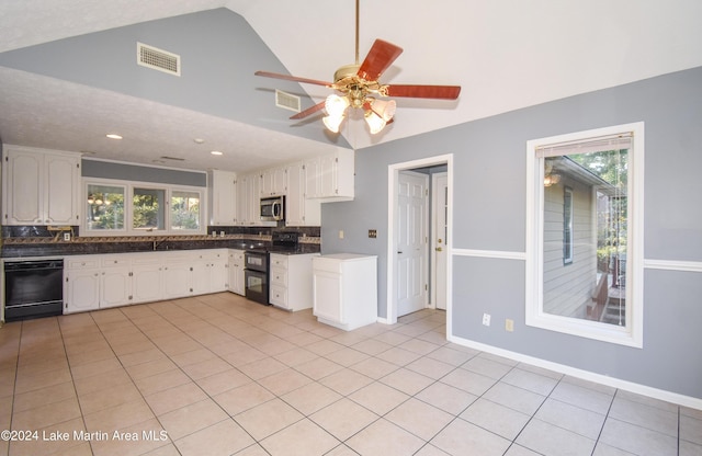 kitchen featuring light tile patterned floors, white cabinets, black appliances, and a textured ceiling