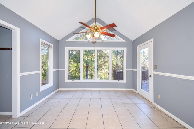 unfurnished sunroom with ceiling fan and vaulted ceiling