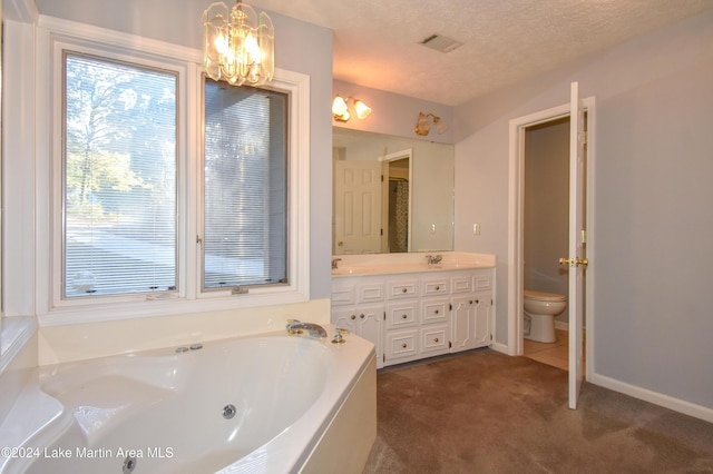 bathroom with an inviting chandelier, a textured ceiling, toilet, a bathtub, and vanity