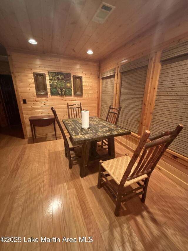 151 Pemberton Rd, Tallassee, AL 36078 - dining space featuring light wood-type flooring, wood ceiling, recessed lighting, and wooden walls