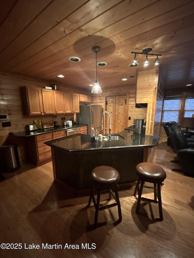 151 Pemberton Rd, Tallassee, AL 36078 - kitchen with a sink, freestanding refrigerator, dark countertops, light wood-style flooring, and wooden ceiling