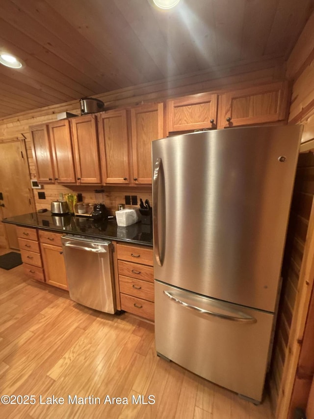 151 Pemberton Rd, Tallassee, AL 36078 - kitchen with appliances with stainless steel finishes, dark countertops, light wood-type flooring, wood ceiling, and brown cabinets