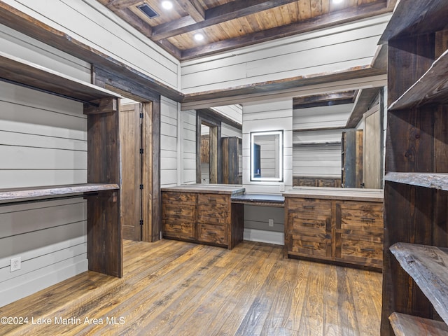 bathroom with wood walls, beamed ceiling, wood ceiling, and hardwood / wood-style flooring