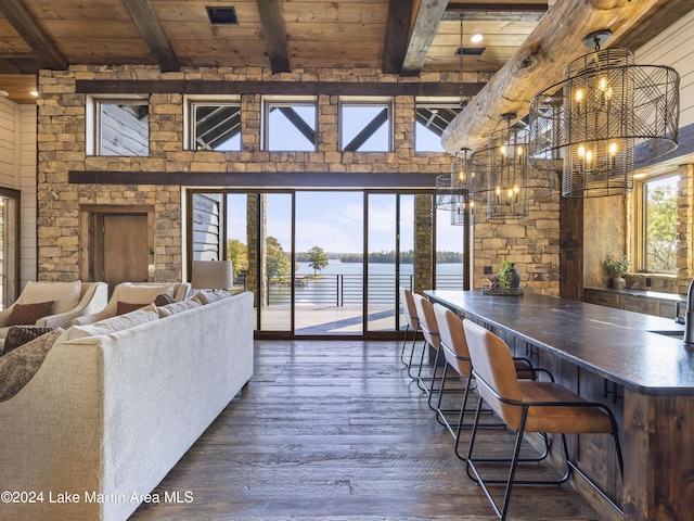 dining area with wooden ceiling, dark wood-type flooring, high vaulted ceiling, a water view, and beamed ceiling