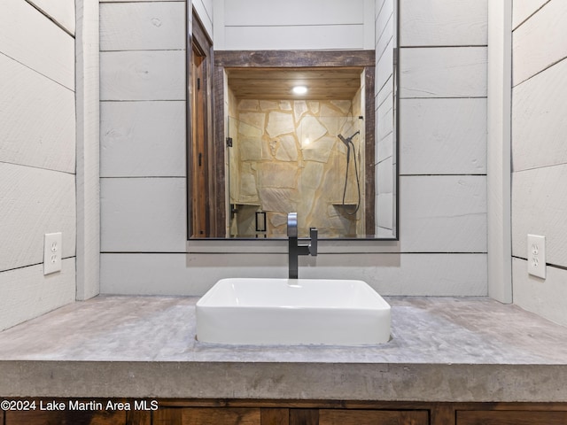 interior details with vanity and wooden walls