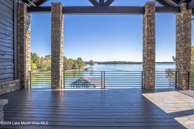 wooden deck with a water view