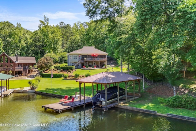 314 Daine Dr, Jacksons Gap, AL 36861 - dock with boat lift, a deck with water view, a yard, and stairs