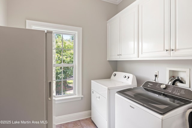 314 Daine Dr, Jacksons Gap, AL 36861 - laundry room with cabinet space, separate washer and dryer, and baseboards