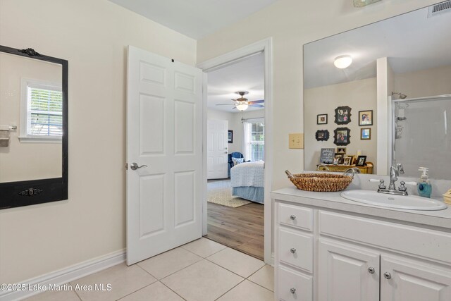 314 Daine Dr, Jacksons Gap, AL 36861 - bathroom featuring vanity, tile patterned floors, a shower, ensuite bathroom, and a ceiling fan