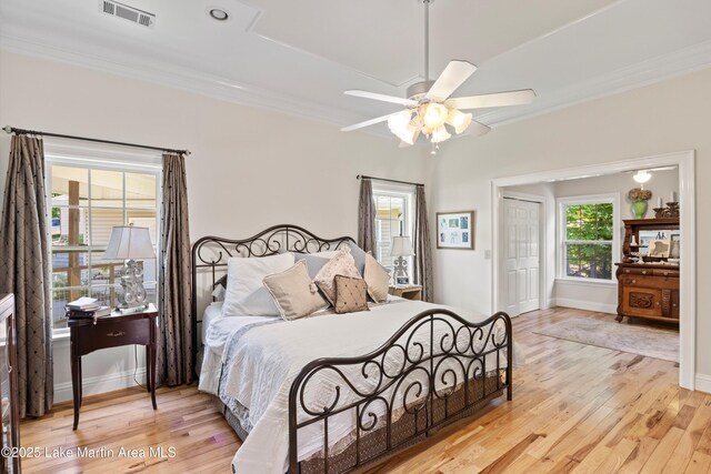 314 Daine Dr, Jacksons Gap, AL 36861 - bedroom with crown molding, wood finished floors, baseboards, and a closet