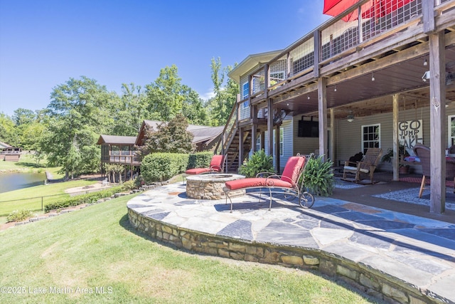 314 Daine Dr, Jacksons Gap, AL 36861 - view of patio featuring a fire pit, stairway, and a wooden deck