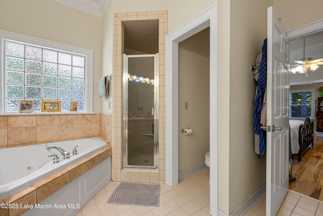 314 Daine Dr, Jacksons Gap, AL 36861 - bathroom with a whirlpool tub, a stall shower, toilet, connected bathroom, and crown molding