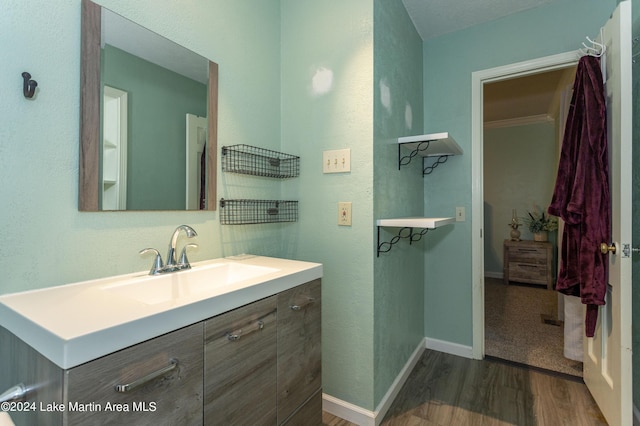 bathroom with vanity and hardwood / wood-style flooring