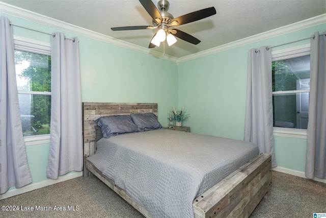 bedroom with carpet flooring, ceiling fan, crown molding, and a textured ceiling