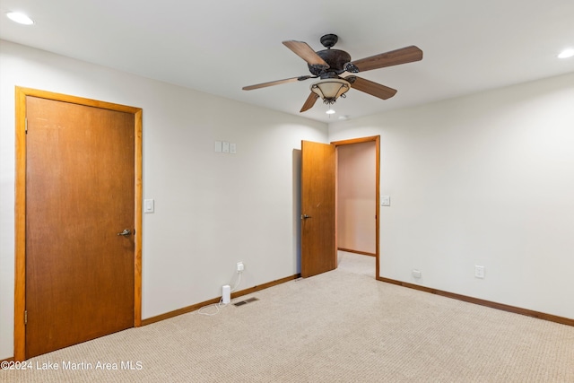 unfurnished bedroom with recessed lighting, visible vents, light colored carpet, and baseboards