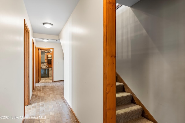 hall with stairway and baseboards