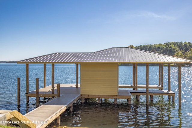 view of dock featuring a water view and boat lift